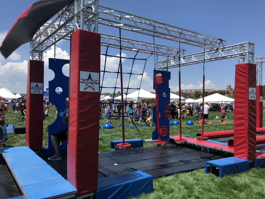 Close view of ninja course obstacles, padding and mats at a festival